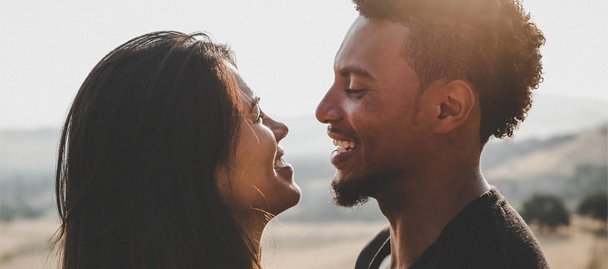 A couple smiling at each other